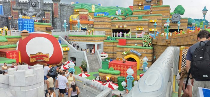 A birds-eye view over the block-stacked castles and pipes of the video-game-themed land.