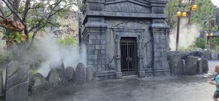 Fog rolls out of the Frankenstein Catacombs entrance as one of the kids dashes past.