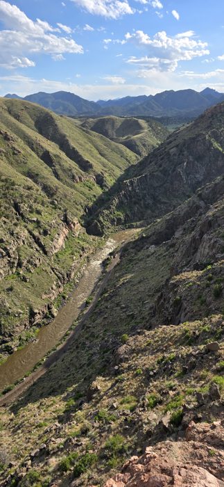 Steep green-and-granite walls plunging into the Arkansas River far below.