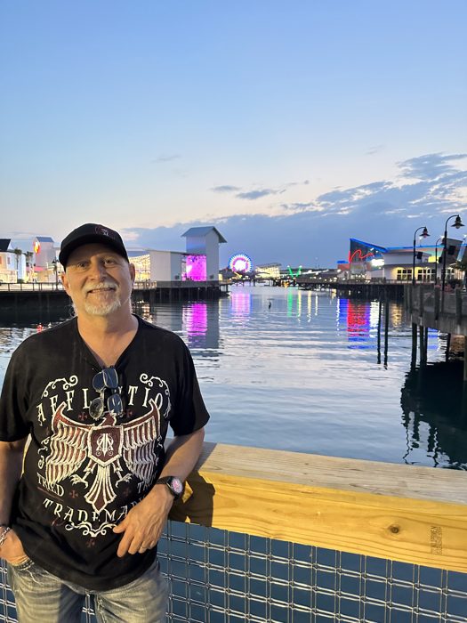 Golden hour on the boardwalk with the SkyWheel and harbor behind us.