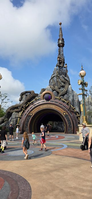 Wandering the mosaic plaza in front of the monster-land entrance before diving in.