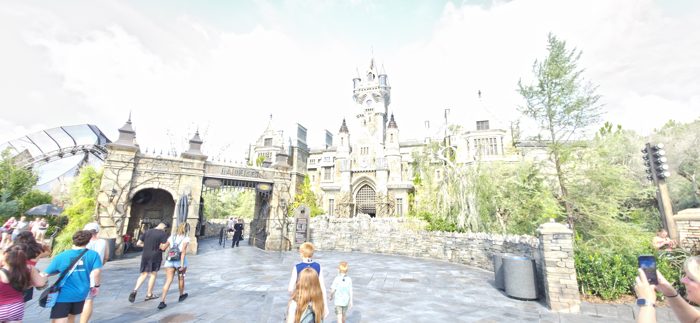 The kids lead the way past the Frankenstein gate toward the castle beyond.