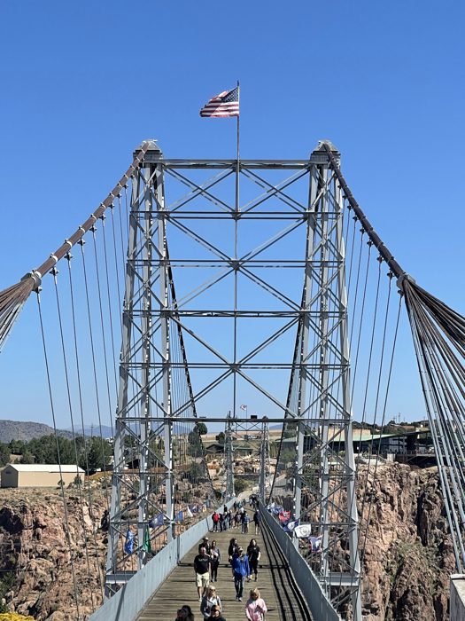 The Royal Gorge Bridge stretching across the canyon, towers reaching skyward.