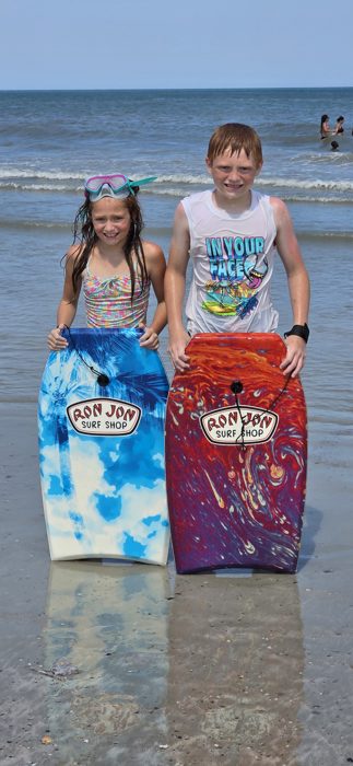 The kids show off their new Ron Jon bodyboards after a morning in the surf.