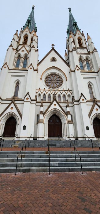 The soaring twin spires of the Cathedral of St. John the Baptist, one of Savannah's signature landmarks.