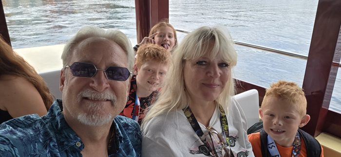 Another round of goofy faces from the back seat on the water taxi.