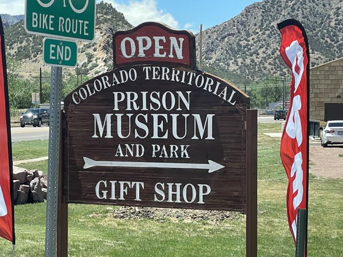 The entrance sign for the Colorado Territorial Prison Museum and Park gift shop.