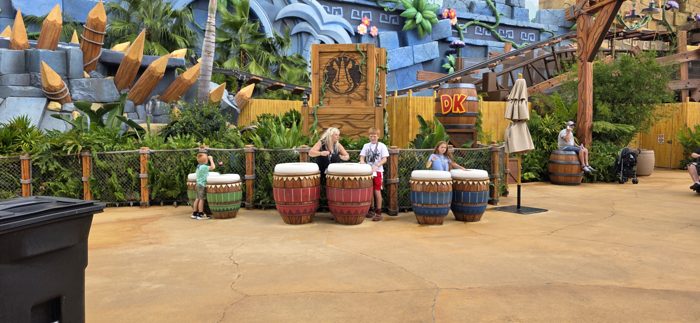 Kids banging away on the oversized jungle drums outside Donkey Kong's barrel-topped hideout.