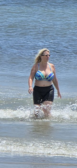 Wading in from a cool dip in the ocean on a hot beach afternoon.