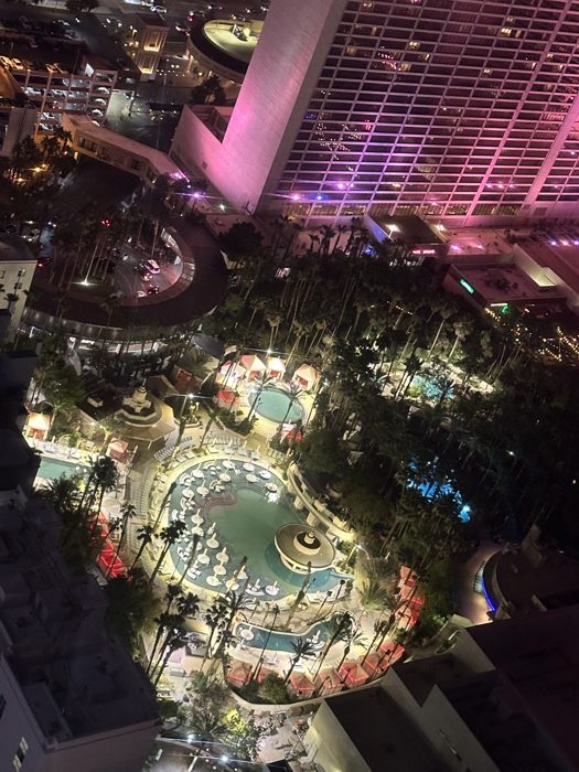 Sweeping nighttime view over the glittering Las Vegas Strip from up high.