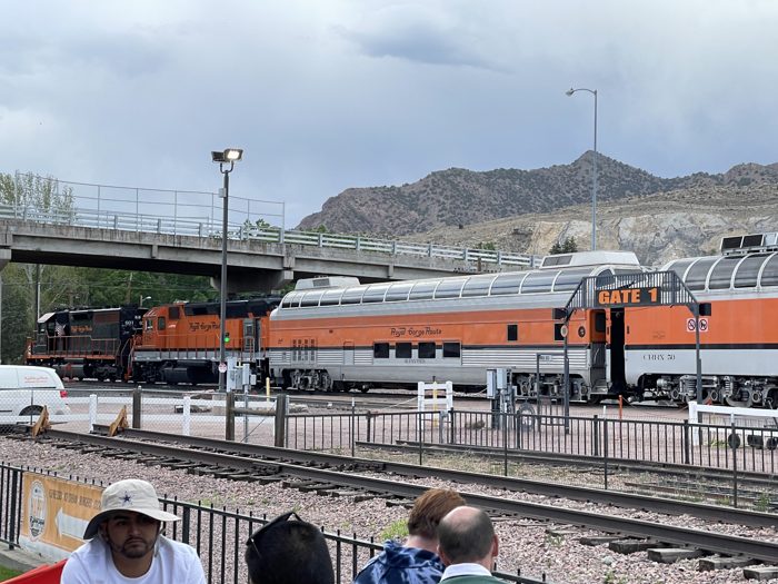 The gleaming orange-and-silver Royal Gorge Route train waiting at the platform.