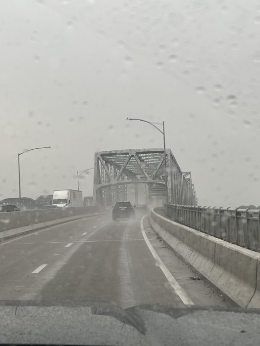 Rain streaking the windshield as we cross the river bridge into Memphis.
