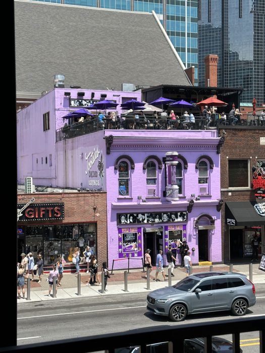 The colorful storefronts of Broadway seen by day.