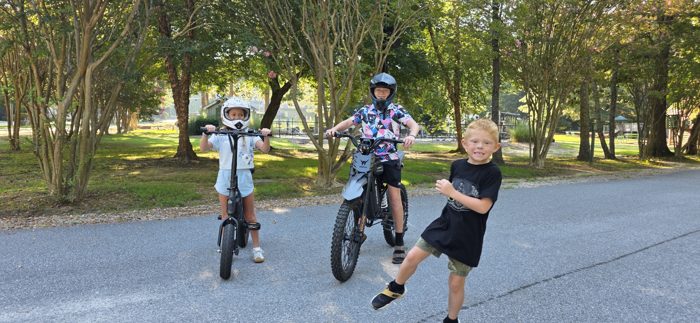 The youngest dashes into frame to join his siblings before the ride.