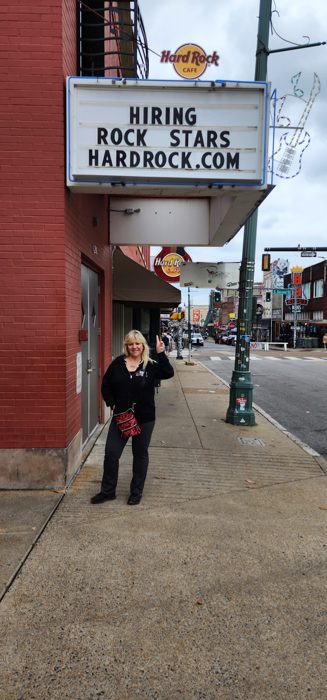 Striking a pose outside the Hard Rock Cafe on our Memphis walk downtown.