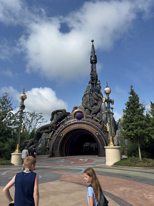 The kids lead the way toward the dark tunnel entrance ahead.