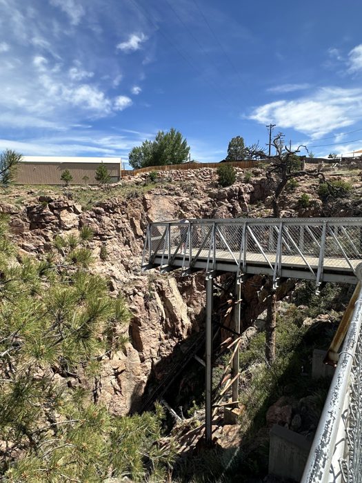 First look at the Royal Gorge Bridge stretching across the dramatic granite canyon.