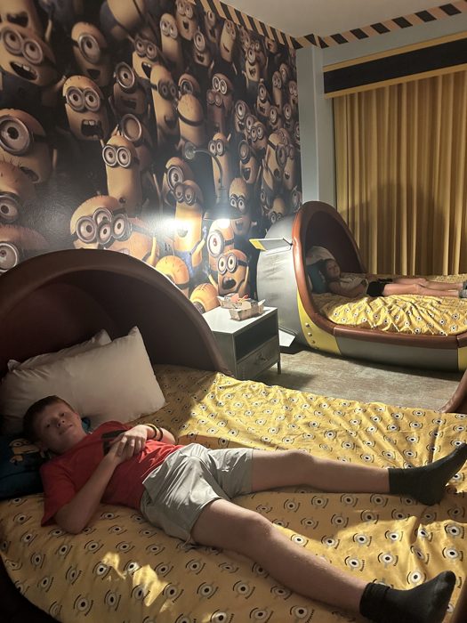 The kids sprawled out on their Minion-print beds, worn out after a full day at the parks.