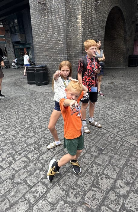 Another dramatic wand pose in the alley, ready for the next duel.