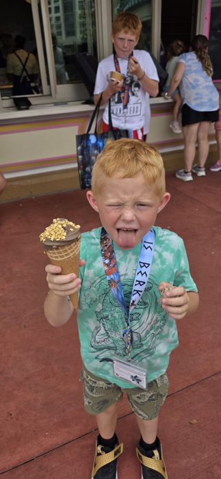 Tongue out and grinning around the same over-the-top ice cream cone a second later.
