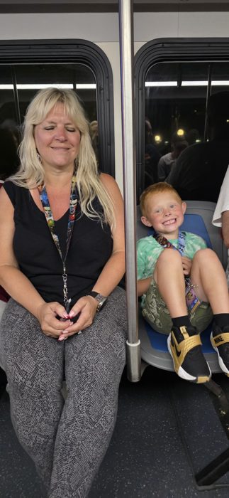 One of the kids grins ear to ear on the ride back, riding shotgun next to Mom on the monorail.
