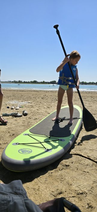 First paddleboard lesson on the sand before heading out onto Boyd Lake.
