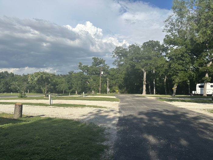 The quiet paved drive winding through our tree-lined RV park.
