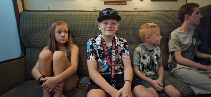The kids lined up on the bench seats of the Hogwarts Express, taking it all in.