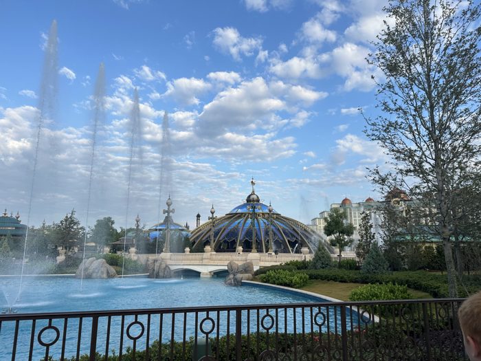 Fountains shoot skyward past an ornate blue-domed pavilion at the heart of the new park.