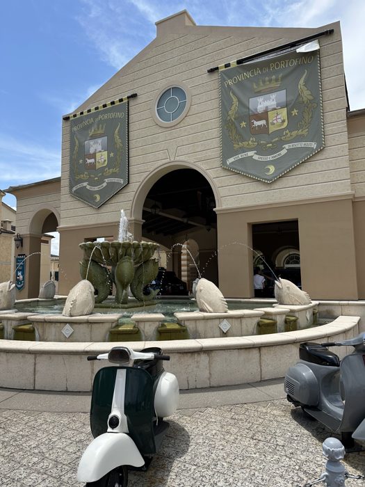 Vintage Vespas parked by the fountain outside Universal's Portofino Bay Hotel.