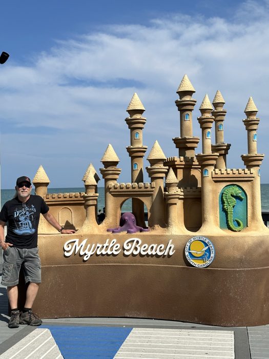 A sand-sculpted castle marking the Myrtle Beach boardwalk.