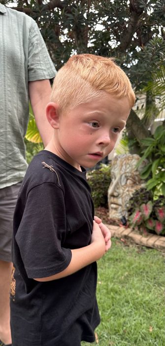 Still hanging on for one more look, the little anole clinging to his shirt.
