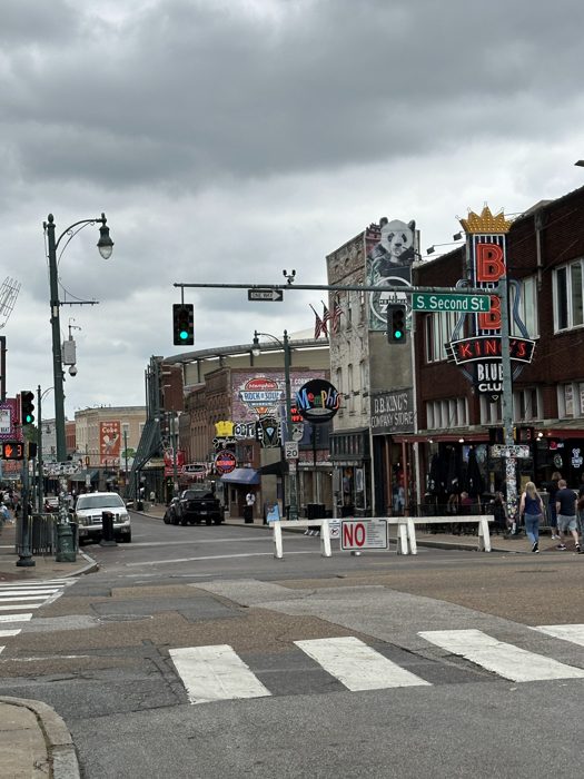 A classic look down historic Beale Street with its blues clubs and bright signs.