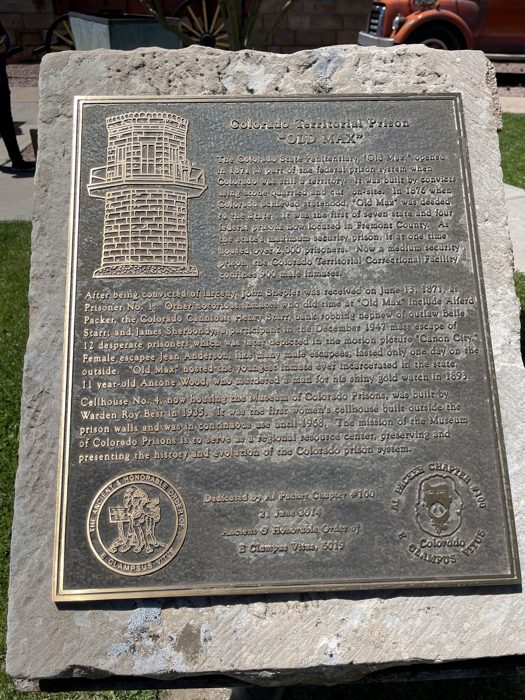 An old engraved memorial tablet on display at the Museum of Colorado Prisons.