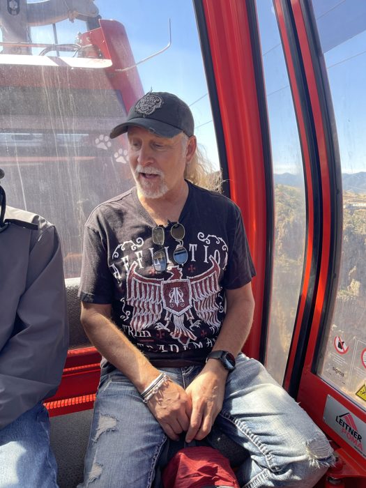 All buckled in and grinning aboard the red gondola car for the ride over the gorge.