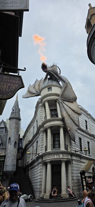 The Gringotts dragon breathes a fireball out over Diagon Alley.