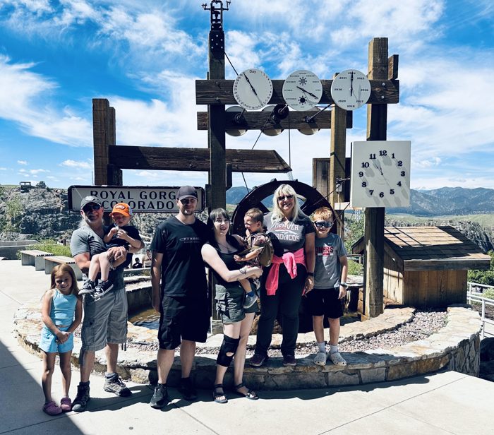 The whole family lined up behind the stocks photo prop for a classic Royal Gorge group shot.